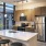 a kitchen with a table and stools